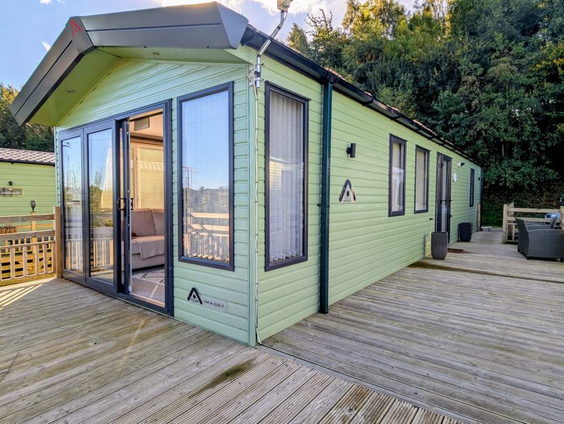 Green-clad Atlas Image 7 with wraparound timber deck and outdoor seating